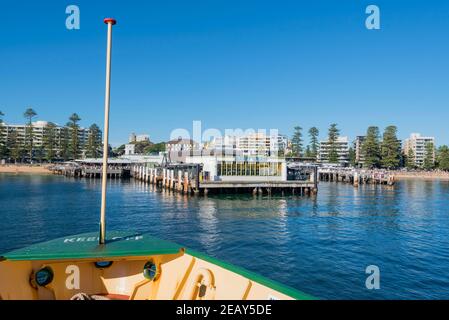 Looking over the bow of a Manly Ferry as it approaches the terminal (wharf) at Manly, New South Wales, Australia Stock Photo
