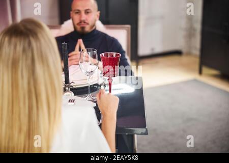 Handsome man sitting in a restaurant with his girlfriend Stock Photo