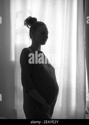 Pregnant naked large woman silhouette Stock Photo - Alamy