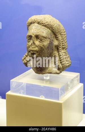 Аncient Egyptian figure, head of a man, part of an exhibition at the History Museum in Naples, Italy. Stock Photo