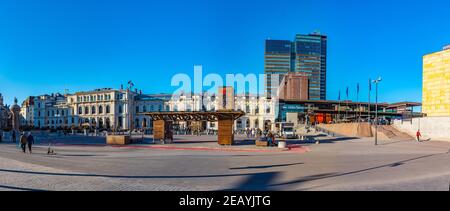 OSLO, NORWAY, APRIL 15, 2019: People are strolling on a square in front of the railway station in Oslo, Norway Stock Photo