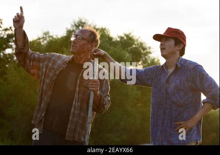 WILL PATTON and STEVEN YEUN in MINARI (2020), directed by LEE ISAAC CHUNG. Credit: PLAN B ENTERTAINMENT / Album