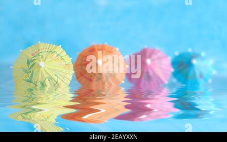 Multicolored Cocktail Umbrellas, spring and summer holidays symbol, selective focus, free copy space Stock Photo