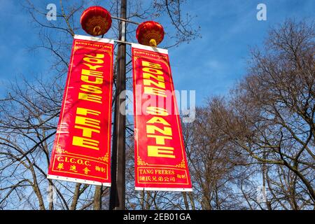 PARIS, FRANCE - FEBRUARY 14, 2019: Chinese New Year celebration in Paris. Street decoration with traditional red lanterns and wishes Stock Photo