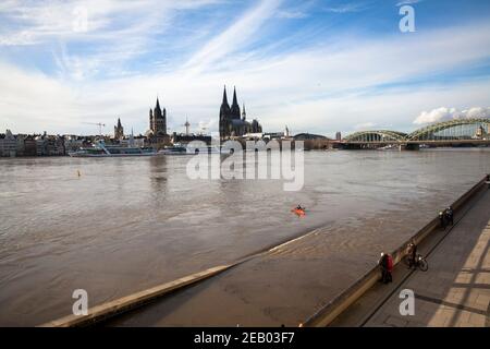 flood of the Rhine on February 4th. 2021, view from the flooded bank of the Rhine in Deutz to the Cathedral and the church Gross St. Martin, Cologne, Stock Photo