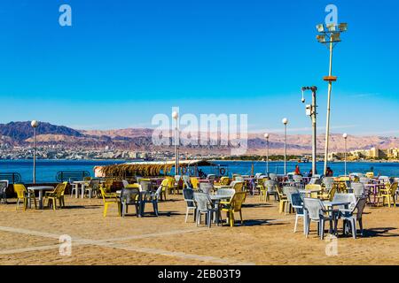 AQABA, JORDAN, DECEMBER 31, 2018: Open air restaurant at the arab revolt square in Aqaba, Jordan Stock Photo