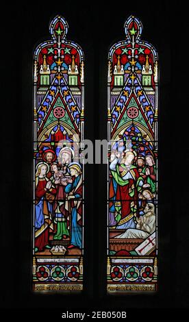 A stained glass window by R B Edmundson: Presnetation of Jesus in the Temple and the Raising of Lazarus,  All Saints Church, Boltongate, Cumbria Stock Photo