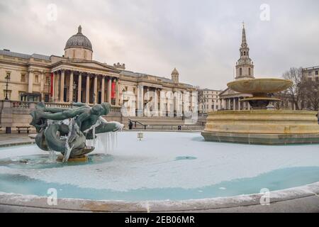 London, UK. 11th Feb, 2021. A fountain is completely frozen in Trafalgar Square, London.Temperatures in the UK plummeted overnight, with parts of the country recording the lowest temperatures in more than a quarter of a century. Credit: SOPA Images Limited/Alamy Live News Stock Photo