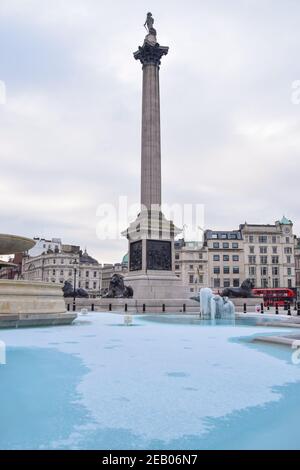 London, UK. 11th Feb, 2021. A fountain is covered in ice in Trafalgar Square, London.Temperatures in the UK plummeted overnight, with parts of the country recording the lowest temperatures in more than a quarter of a century. Credit: SOPA Images Limited/Alamy Live News Stock Photo