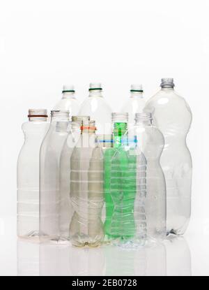 A selection of plastic bottles shot on a white background with refection possible use for recycling stories. Stock Photo