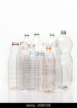 A selection of plastic bottles shot on a white background with refection possible use for recycling stories. Stock Photo