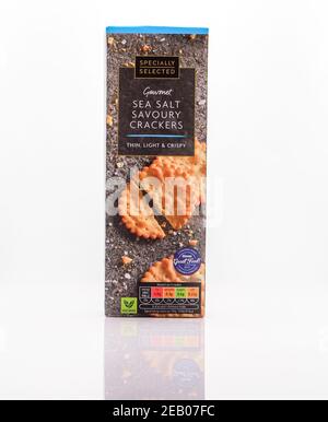 Sea salt savoury crackers product shot on a white background with a reflection. Stock Photo