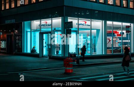 Customers use ATMs at a branch of Capital One Bank in Midtown Manhattan in New York on Wednesday, January 13, 2021.  (© Richard B. Levine) Stock Photo