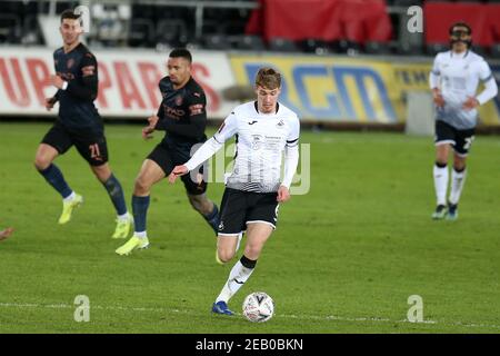 Swansea, UK. 10th Feb, 2021. Jay Fulton of Swansea city (c) in action.The Emirates FA Cup, 5th round match, Swansea city v Manchester City at the Liberty Stadium in Swansea, South Wales on Wednesday 10th February 2021. this image may only be used for Editorial purposes. Editorial use only, license required for commercial use. No use in betting, games or a single club/league/player publications. pic by Andrew Orchard/Andrew Orchard sports photography/Ģ����ý Live news Credit: Andrew Orchard sports photography/Ģ����ý Live News Stock Photo