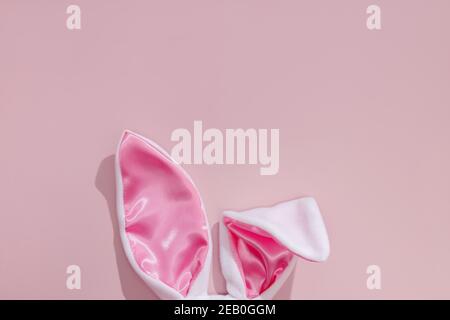 Decorative bunny ears on pink background. Stock Photo