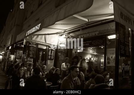 PARIS, FRANCE - OCTOBER 19, 2019:  Parisians and tourists drinking, eating, socializing and relaxing at evening at Everest cafe located near Pompidou Stock Photo