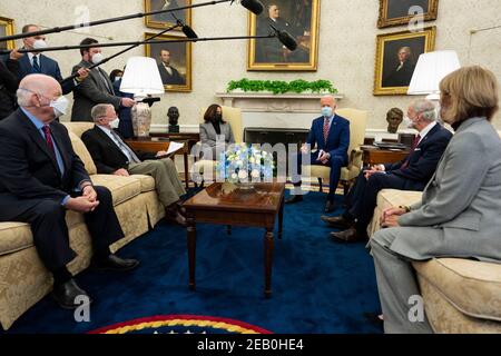United States President Joe Biden and US Vice President Kamala Harris meets with Senators from both parties on the critical need to invest in modern and sustainable American infrastructure, in the Oval Office.Thursday, Feb. 11, 2021. US Senator Jim Inhofe (Republican of Oklahoma) and US Senator Tom Carper (Democrat of Delaware) are among those attending the meeting.Credit: Doug Mills/Pool via CNP /MediaPunch Stock Photo