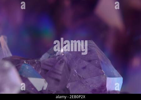 artistic, detailed macro shot with wide depth of field of a raw amethyst crystal cluster, a violet colored quartz variety Stock Photo