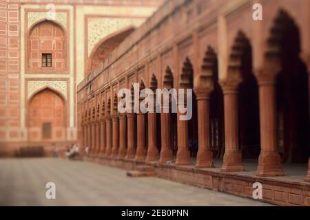 One of the buildings in Taj Mahal complex with arches and columns. Selective focus made with tilt-shift effect. Agra, Uttar Pradesh, India Stock Photo