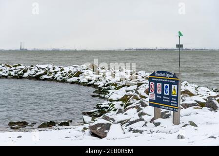 Three Shells Lagoon man made saltwater swimming pool in Southend on Sea, Essex, UK, with snow from Storm Darcy Stock Photo