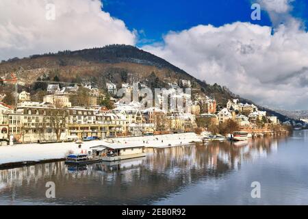 Heidelberg, Germany - February 2021: View on Odenwald forest hill called Heiligenberg with historical mansions covered in snow and neckar river Stock Photo