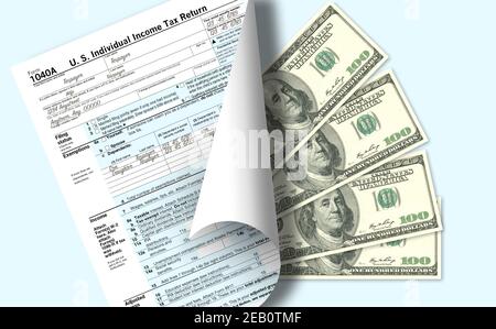 A USA federal income tax form 1040 is seen with four one-hundered dollar bills to represent taxes to be paid or a tax refund that will come back to th Stock Photo