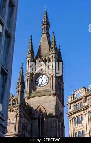 The impressive pinnacled clock tower on the wool exchange building in Bradford, West Yorkshire Stock Photo