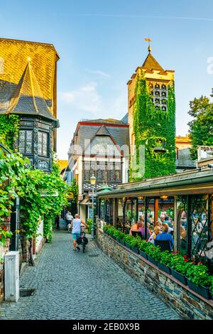 RUDESHEIM AM RHEIN, GERMANY, AUGUST 16, 2018: Tourists are strolling through famous Drosselgasse street in Rudesheim am Rhein in Germany Stock Photo