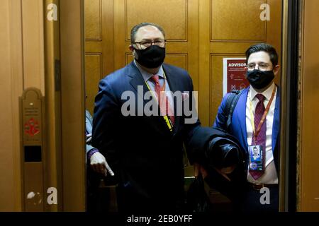 Washington, United States. 11th Feb, 2021. Jason Miller (L), advisor to former US President Donald Trump, arrives on the third day of the second impeachment trial at the Capitol in Washington, DC on Thursday, February 11, 2021. Arguments will be presented in the impeachment trial of former President Donald Trump today. Pool Photo by Michael ReynoldsUPI Credit: UPI/Alamy Live News Stock Photo