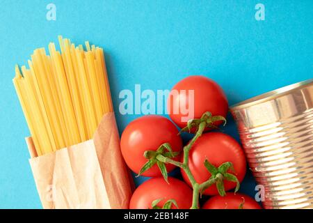 Pasta ingredients with tomatoes. Ingredients for cooking. National Italian healthy food. Top view. Stock Photo