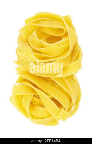 Italian pasta fettuccine nests isolated on white background. Pasta tagliatelle top view Stock Photo