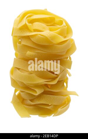 Italian pasta fettuccine nests isolated on white background. Pasta tagliatelle top view Stock Photo