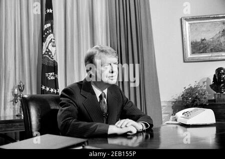 U.S. President Jimmy Carter in Oval Office during TV Speech, White House, Washington, D.C., USA, Warren K. Leffler, April 18, 1977 Stock Photo