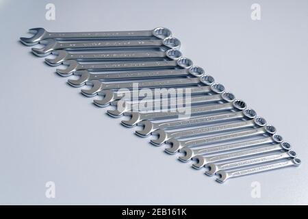 Cut-out wrenches horizontally placed from the biggest to the smallest in a row. Top view composition. Hand tool. Tools for carpentry work. Type of fas Stock Photo