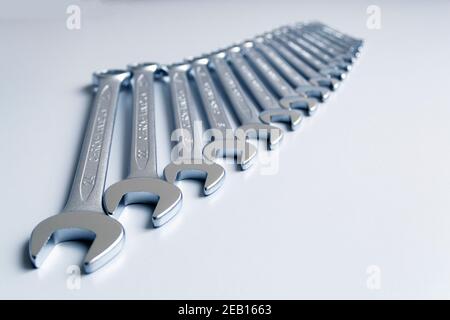 Cut-out wrenches horizontally placed from the biggest to the smallest in a row. Top view composition. Hand tool. Tools for carpentry work. Type of fas Stock Photo