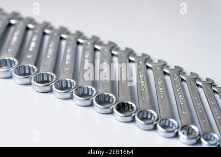 Cut-out wrenches horizontally placed from the biggest to the smallest in a row. Top view composition. Hand tool. Tools for carpentry work. Type of fas Stock Photo