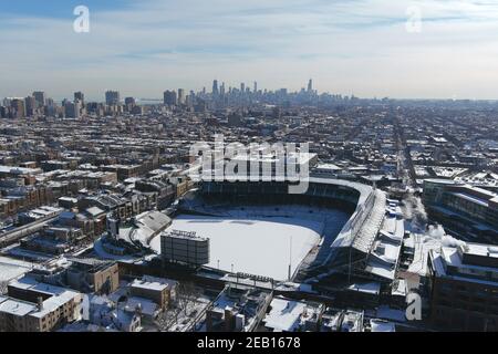 An aerial view of Wrigley Field and the downtown skyline, Sunday, Feb. 7, 2021, in Chicago. The stadium is the home of the Chicago Cubs. Stock Photo