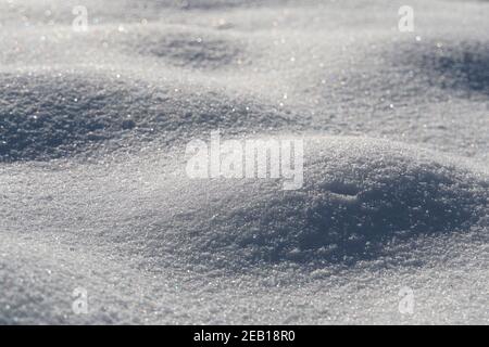 Only pure white snow. A untouched snow carpet covering everything. Snow sparkles Stock Photo