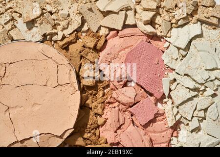 Broken eyeshadows in trendy shades isolated on white background Stock Photo
