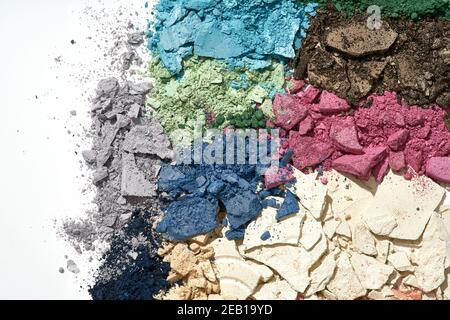 Broken eyeshadows in trendy shades isolated on white background Stock Photo