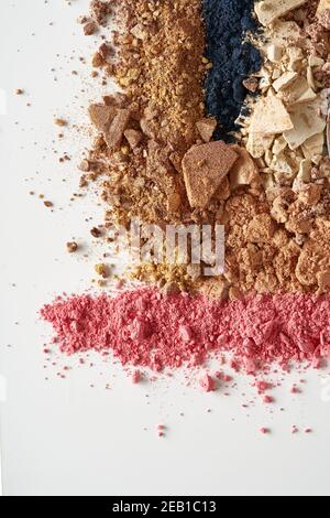 Broken eyeshadows in trendy shades isolated on white background Stock Photo