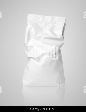 White crumpled blank paper bag package with creases on gray with clipping path Stock Photo