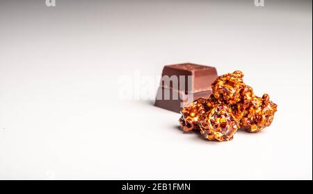 Chocolate popcorn on a white background. Stock Photo