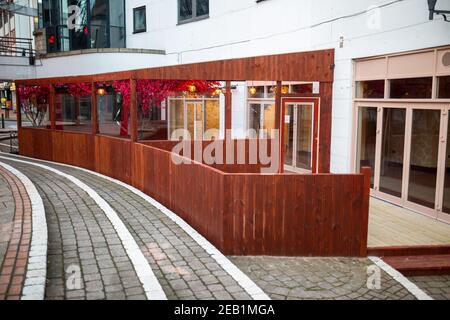 Birmingham, UK. 11th Feb, 2021. A normally vibrant and crowded Chinese Quarter in Birmingham, UK, is unusually quiet as Chinese communities in the city are forced to celebrate the New Year on Friday at home. A bar is deathly quiet due to being closed on the Chinese New Years Eve. Credit: Peter Lopeman/Alamy Live News Stock Photo