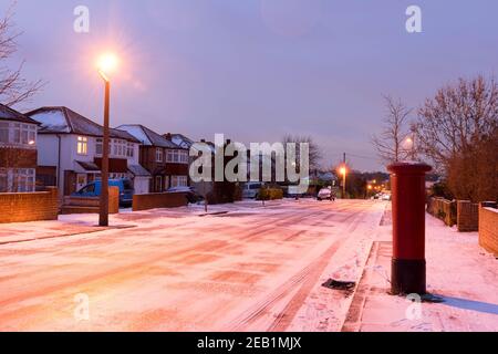 street covered in snow on london street during storm Darcy in February 2021 Stock Photo