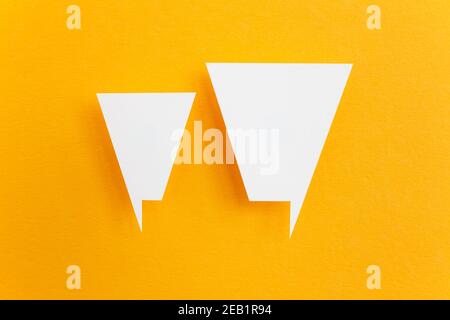 paper speech bubbles on yellow background Stock Photo - Alamy