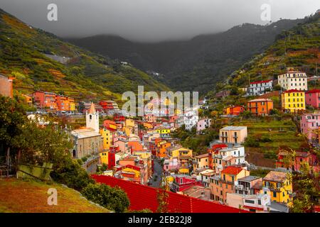Riomaggiore, Liguria Italy. Traditional typical Italian village in National park Cinque Terre, colorful multicolored buildings houses on mountain Stock Photo