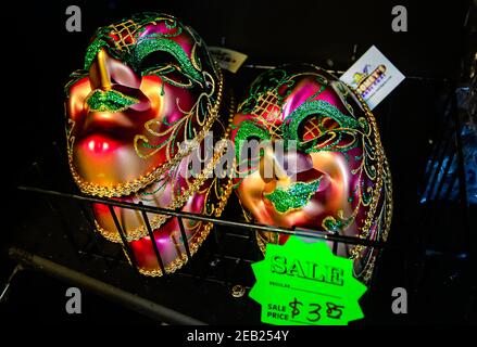 Mardi Gras masks in the full-face Venetian style are displayed for sale at Toomey’s Mardi Gras shop, Feb. 8, 2021, in Mobile, Alabama. Stock Photo