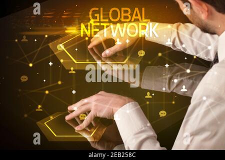 Navigating social networking with GLOBAL NETWORK inscription, new media concept Stock Photo