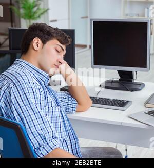 The businessman sitting in front of many screens Stock Photo